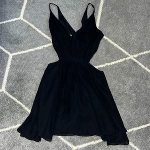 Bebe mini dress, cut out in the sides. Only work once!